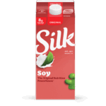 A carton of Silk Soy Milk with a blue and white label, featuring the Silk logo and an image of a splash of soy milk with soybeans.